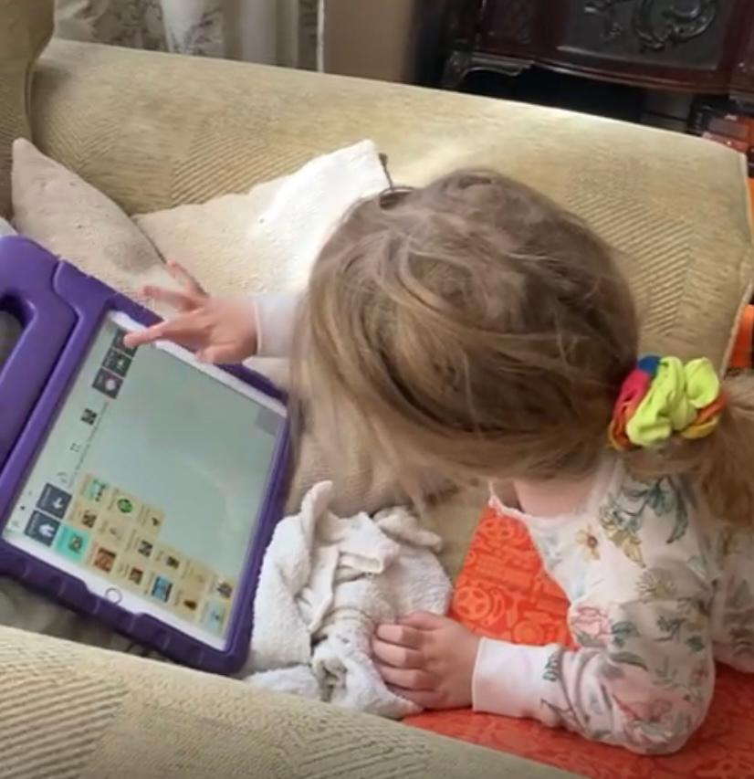A child is using a tablet