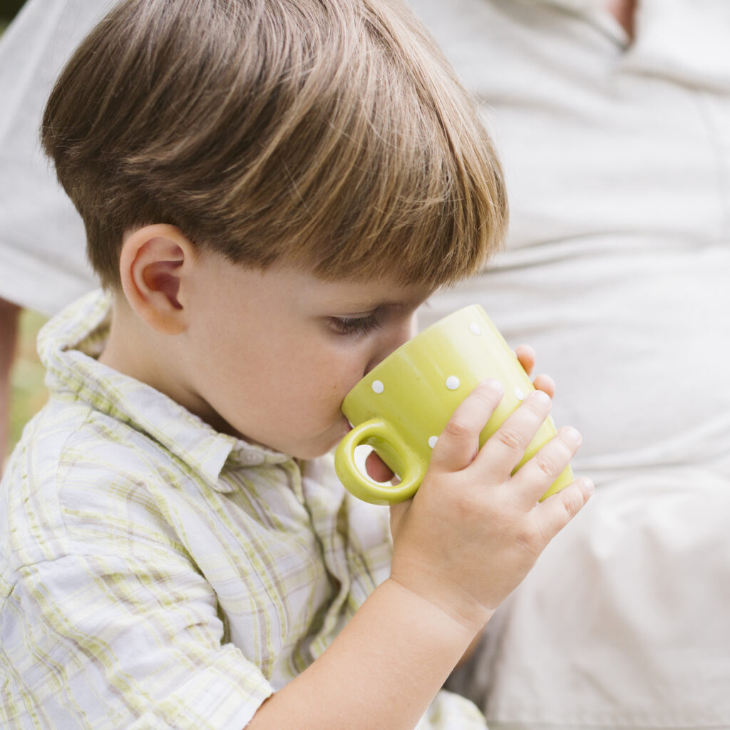 close-up-little-child-drinking-tea